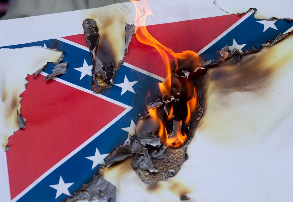 Activists In Los Angeles Gather To Burn Likenesses Of The Confederate Flag