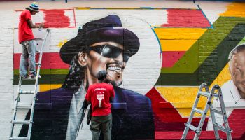 MuralsDC is painting a mural on a wall of Ben's Chili Bowl featuring some of the most noted customers - Bill Cosby, President Obama, Chuck Brown and Donnie Simpson