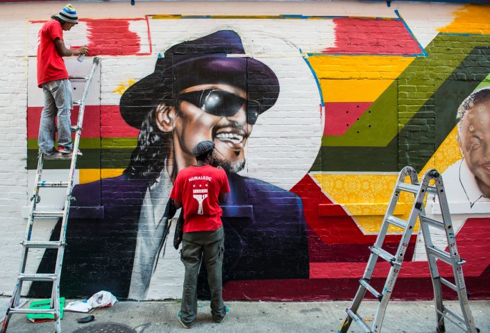 MuralsDC is painting a mural on a wall of Ben's Chili Bowl featuring some of the most noted customers - Bill Cosby, President Obama, Chuck Brown and Donnie Simpson