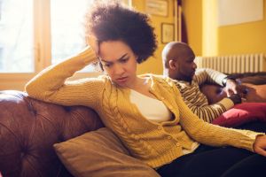 African American couple having relationship difficulties at home.