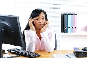 Worried black businesswoman at desk