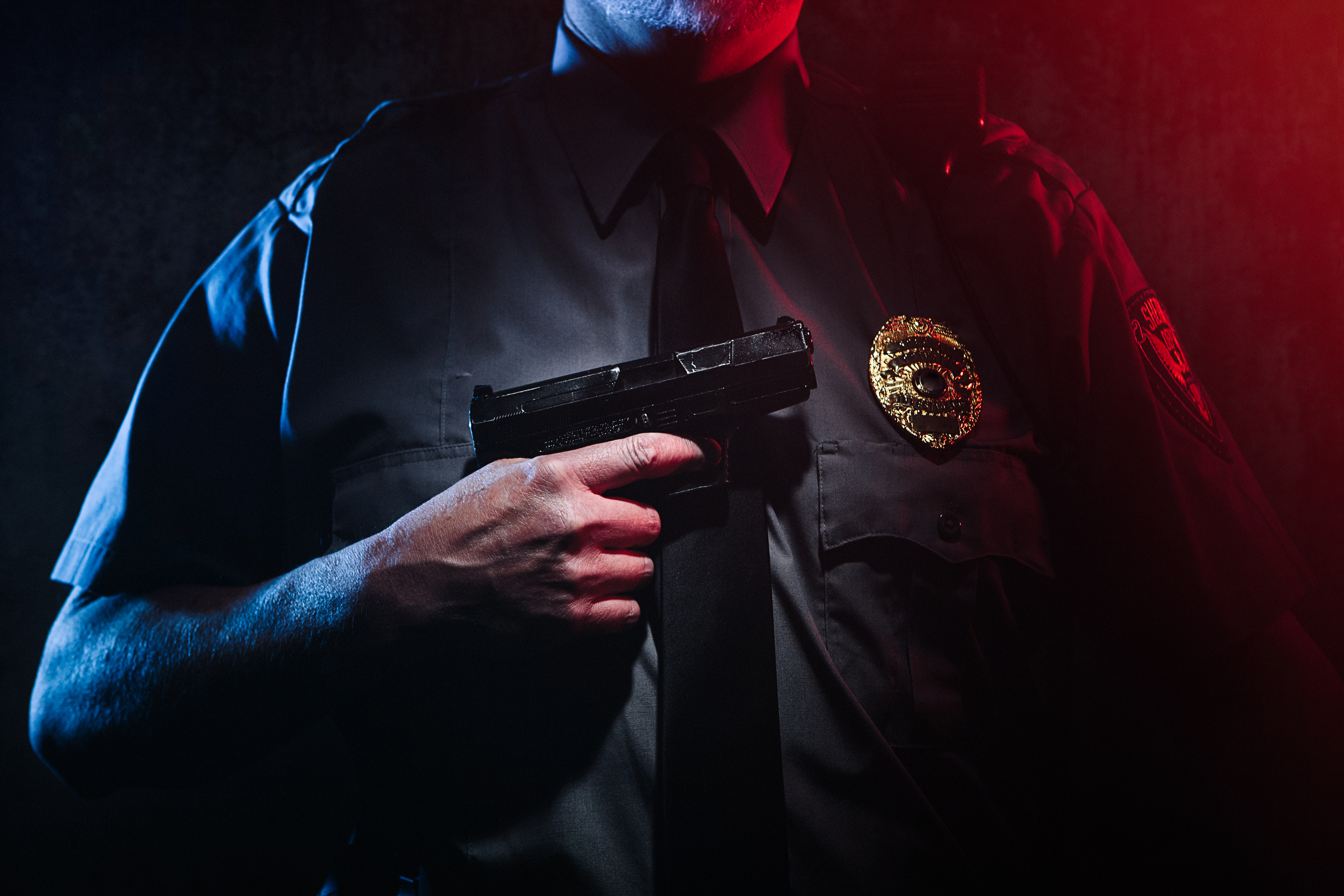 Police Officer Holding Gun