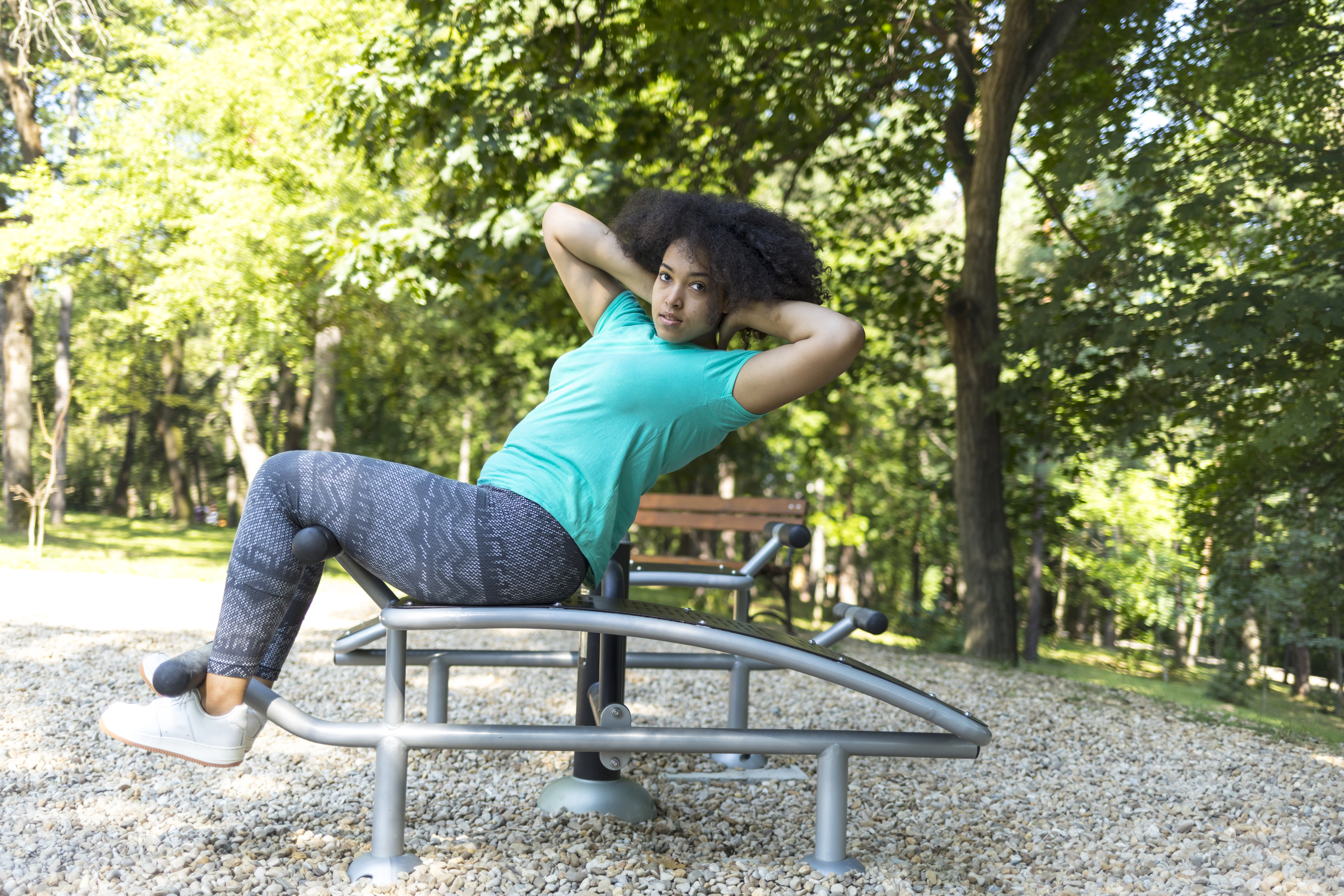 Workout in park on sit-up bench