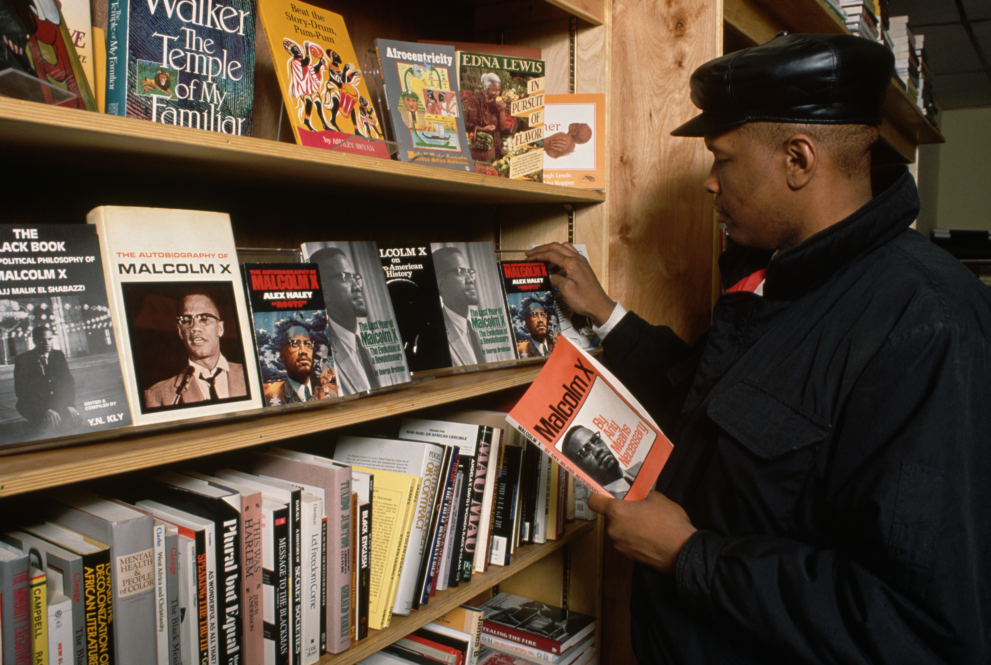 Man Looking at Malcolm X Books