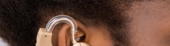 Woman Wearing Hearing Aid In Ear