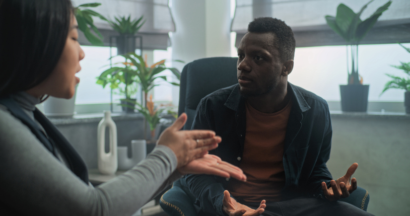 Angry boyfriend starts fight and shouts at his girlfriend during couples therapy