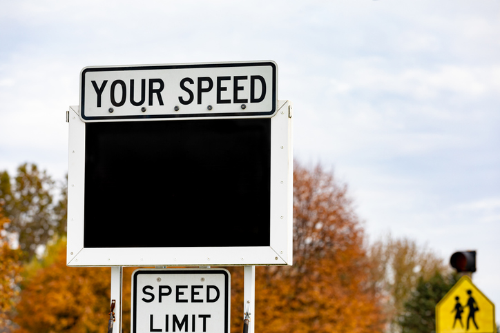 Radar speed trailer in residential neighborhood. Speeding ticket, speed limit and school zone safety