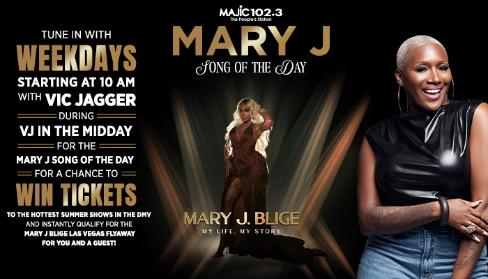 A smiling woman with long blonde hair wearing a black top and jeans, promoting a radio station's "Mary J Song of the Day" contest.